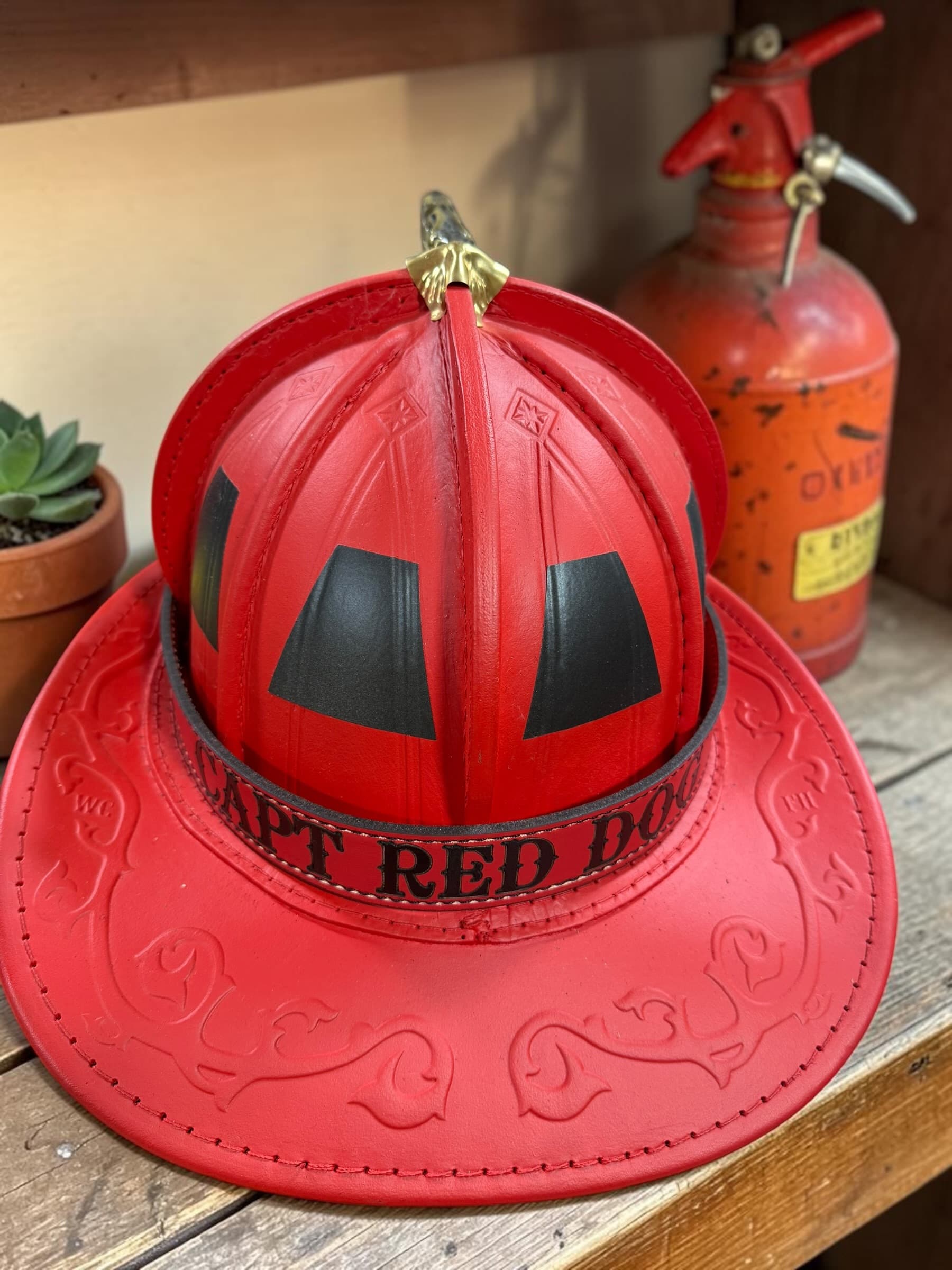 Traditional leather fire helmet band displayed on a fire helmet — view 6