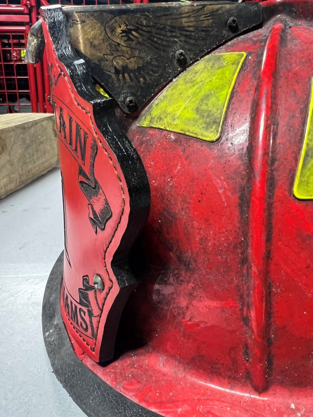 Red shield with black edge detail