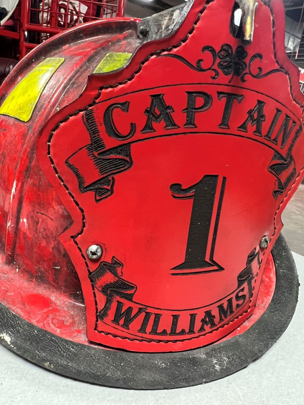 Red captain fire helmet shield