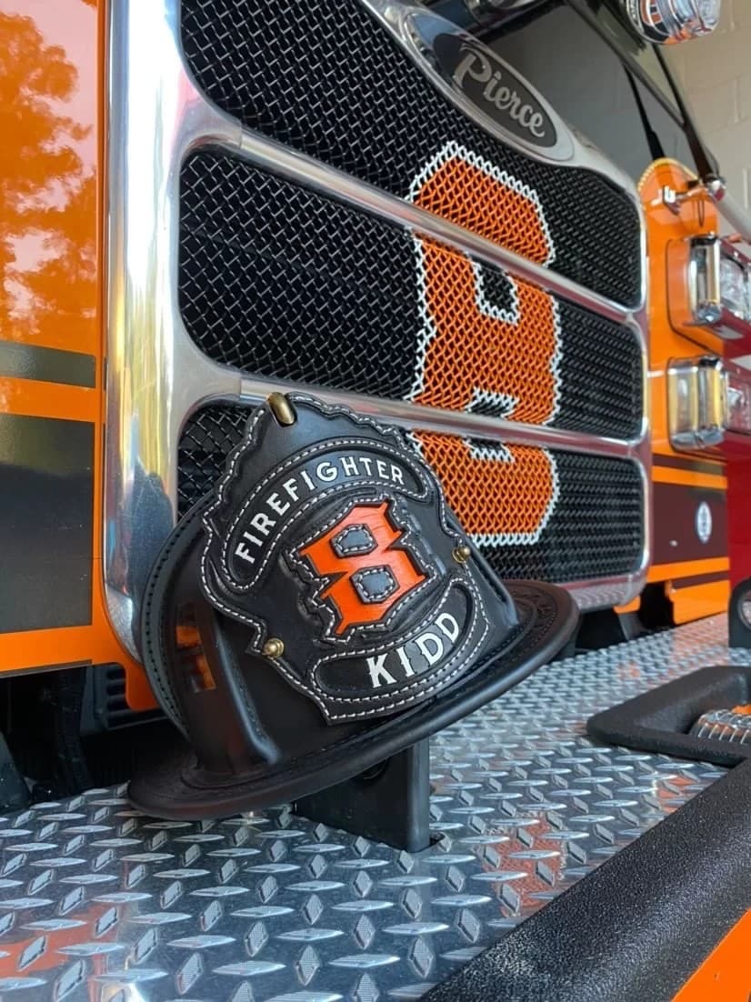 Custom leather Crew fire helmet shield by Fire Helmet Shields